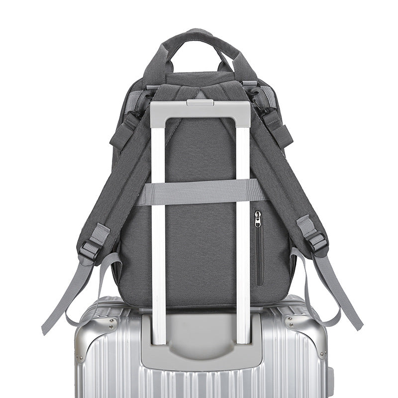 Multi-functional Diaper Bag With A Baby Changing Pad And A Warming Compartment